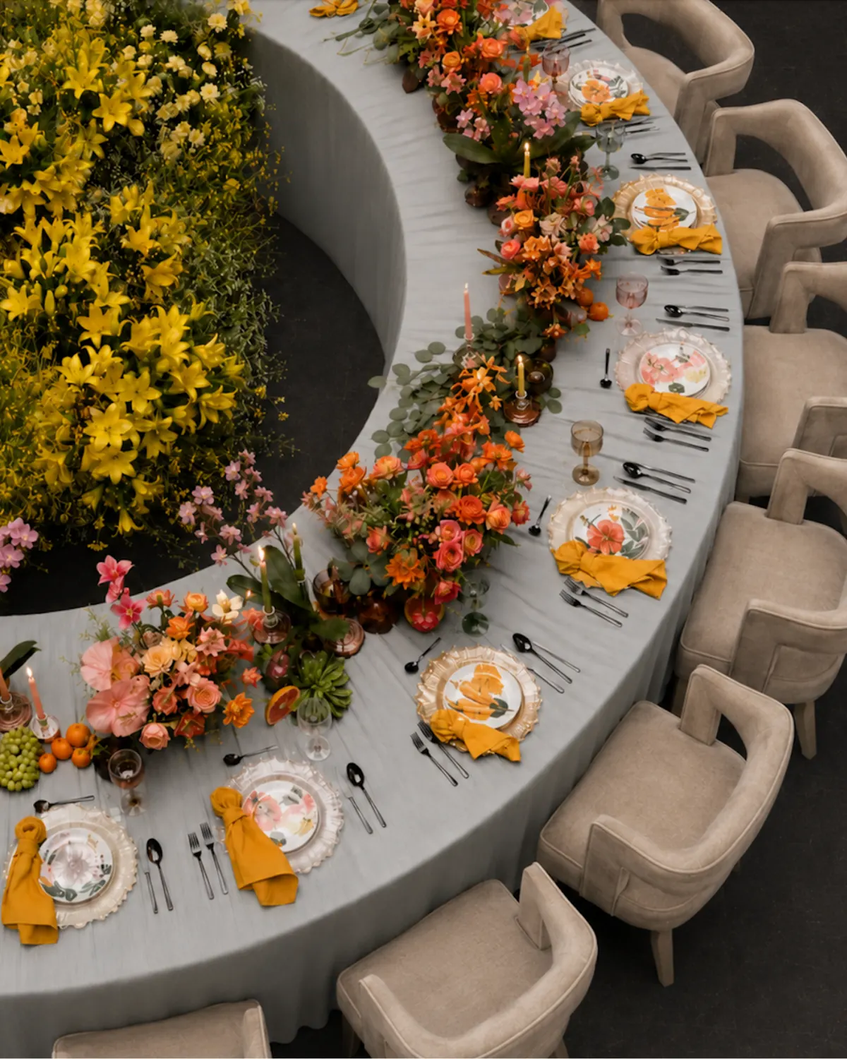 Curved banquet table with cascading florals overhead view — bespoke wedding table design